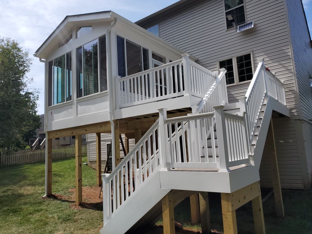 A deck with stairs leading to the upper level.